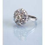 A DIAMOND CLUSTER RING, the seven round brilliant cut stones totalling approximately 3.50cts, claw