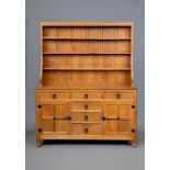 A ROBERT THOMPSON ADZED OAK DRESSER, c.1970's, the delft rack with half penny moulded cornice over