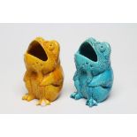 TWO BURMANTOFTS POTTERY TOAD SPOON WARMERS, seated holding their heads in their hands, one