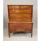 A MAHOGANY CHEST ON STAND, the moulded edged and banded top over two short and three long