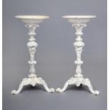 A MATCHED PAIR OF VICTORIAN CAST IRON CONSERVATORY PLANT STANDS, the shallow circular bowl raised on