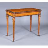 A FINE QUALITY AMBOYNA FOLDING CARD TABLE in the manner of Jackson & Graham, London, the earred