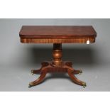 A GEORGIAN MAHOGANY FOLDING TEA TABLE, early 19th century, of rounded oblong form, the swivel top on