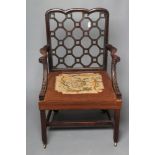 A GEORGIAN MAHOGANY LATTICE BACK ELBOW CHAIR, third quarter 18th century, the beaded edged back with