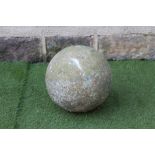 A SANDSTONE SPHERE, 15 1/2" high, together with a pair of stoneware mushroom shaped cowls, 15" x