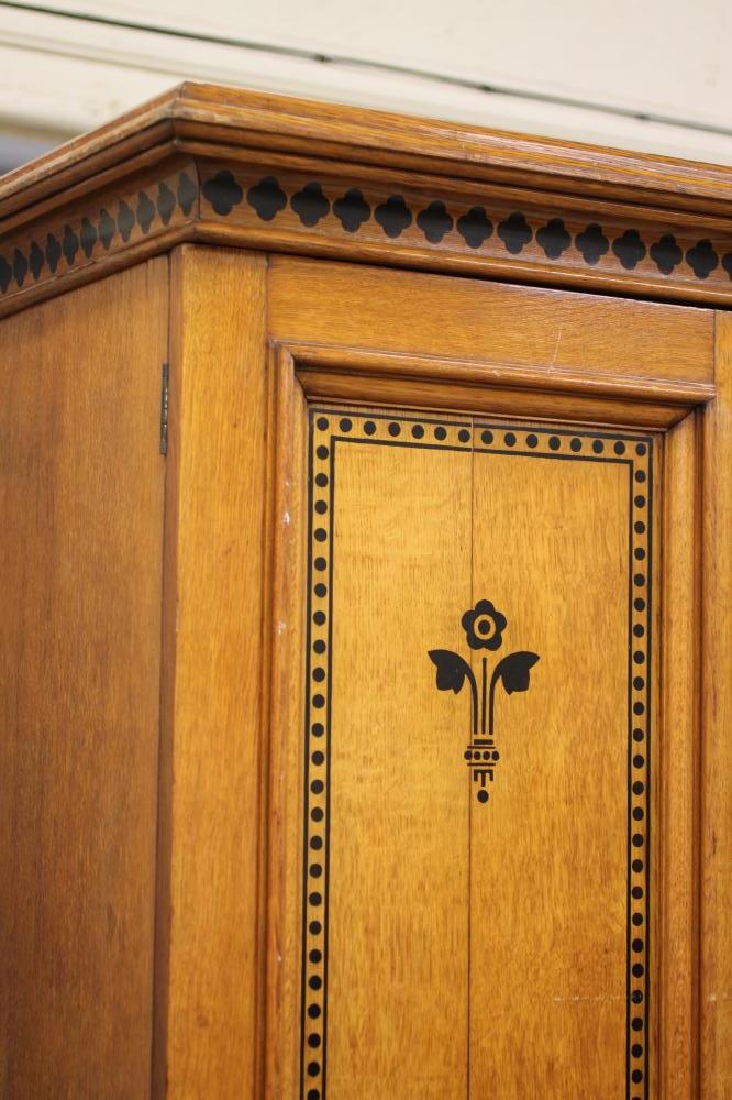 A GOTHIC REVIVAL LIGHT OAK AND BLACK STENCILLED WARDROBE, in the manner of Marsh, Jones & Cribb, the - Image 2 of 13