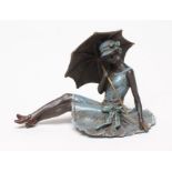 AN EROTIC BRONZE FIGURE modelled as a young lady in 1920's style blue enamelled dress and hat,