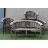 A BRAMBLE CREST TEAK SITTING SUITE comprising a pair of slatted sofas of curved back and