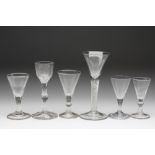 FOUR CORDIAL GLASSES, late 18th century, three with flute moulded conical bowls, one plain with