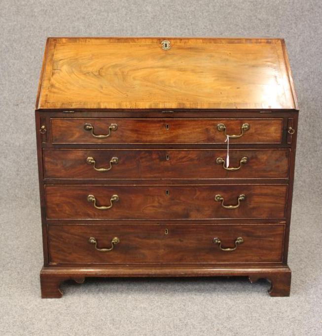 A GEORGIAN MAHOGANY BUREAU, late 18th century, the banded fall front with herringbone stringing