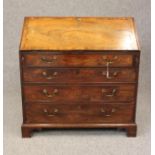 A GEORGIAN MAHOGANY BUREAU, late 18th century, the banded fall front with herringbone stringing