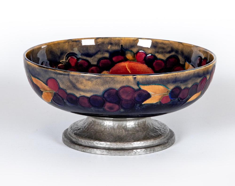 A MOORCROFT POTTERY BOWL, early 20th century, of shallow plain circular form, tubelined and