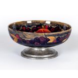 A MOORCROFT POTTERY BOWL, early 20th century, of shallow plain circular form, tubelined and