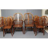 A SET OF SIX WHEELBACK WINDSOR CHAIRS, c.1900, in ash and elm, together with a pair of near matching