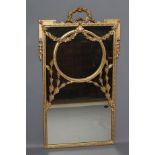 AN EDWARDIAN GILT GESSO PIER GLASS, the oblong plate fronted by ribbon tied floral festoons