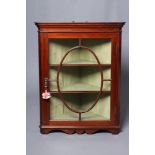 A GEORGIAN MAHOGANY GLAZED CORNER CUPBOARD, late 18th century, the moulded cornice and plain