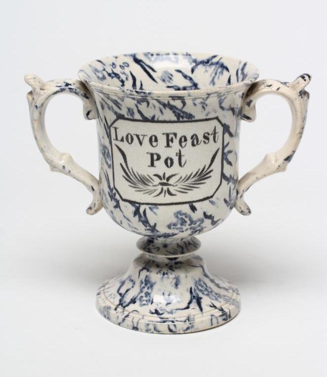 A PEARLWARE LOVING CUP, c.1830, the bell shaped bowl inscribed in black "Love Feast Pot", on a