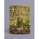 A CARVED SANDSTONE "GREEN MAN" WALL PLAQUE, late 19th century(?), the grotesque mask crisply