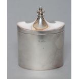 AN EDWARDIAN TEA CANISTER, maker Dixon & Sons, Sheffield 1909, of plain oval form, the hinged
