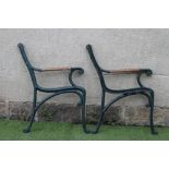 A PAIR OF VICTORIAN CAST IRON PARK BENCH ENDS, the elegant moulded frame terminating in scroll feet,