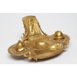 AFTER RENE TAUPIN D'AUGE - a gilt metal desk standish, c.1900, of elongated trefoil form, the