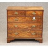 A GEORGIAN MAHOGANY CHEST, last quarter 18th century, the moulded edged top over two short and three