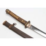 A SHOWA WORLD WAR II KATANA, with 26 1/4" blade, undulating hamon, tang signed to both sides,