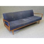 A MID CENTURY SCANDINAVIAN DESIGN TEAK FRAMED SOFA BED, upholstered in mustard coloured tweed, the