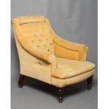 A VICTORIAN WALNUT FRAMED ARMCHAIR upholstered in yellow dralon, button back with bolster head rest,