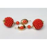 A PAIR OF CORAL EAR BOBS, the beaded spheres with yellow metal mounts on shepherd's crook hooks,