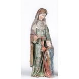 A CARVED WOOD AND POLYCHROME PAINTED FIGURE OF A FEMALE SAINT, North European 16th century, modelled