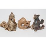THREE BURMANTOFTS "GROTESQUES", comprising a seated dragon with unfurled wings in a two tone brown