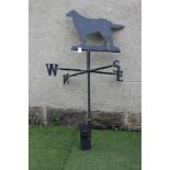 A METAL WEATHER VANE, 20th century, the turned stem issuing the compass points on square branches,