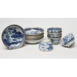 A SET OF SIX CHINESE PORCELAIN RIBBED TEABOWLS AND SAUCERS painted in underglaze blue with a