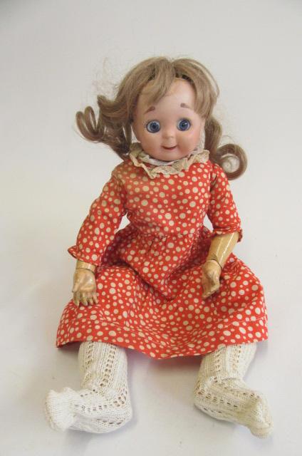 A J.D. Kestner type bisque socket head googly eyed doll with fixed blue paperweight eyes, closed