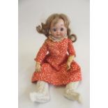A J.D. Kestner type bisque socket head googly eyed doll with fixed blue paperweight eyes, closed