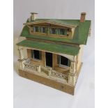 A rare pre-war "Moko" dolls house of painted wooden construction, with veranda, dormer windows and