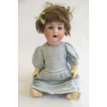 A Schutzmeister & Quendt bisque socket head doll, with blue glass sleeping eyes, open mouth with two
