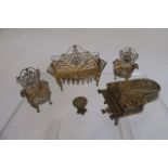 A set of five bi-colour silver filigree dolls house items comprising a settee and two matching