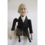 A Lloyd George clockwork doll, with painted composition head, wooden limbs, felt jacket and