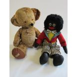 A large Merrythought bear, c.1960, with amber eyes, sewn nose, a bell in each ear, felt pads and