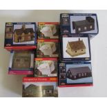 Nine lineside buildings by Hornby and Bachmann including houses, workshop and small engine shed,