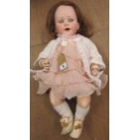 A Jutta bisque socket head crying doll, with blue glass sleeping eyes, open mouth, nylon wig, bent