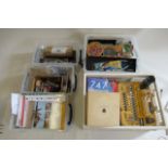 Five plastic boxes containing model making tools including paint, knives, clamps, glue brushes,