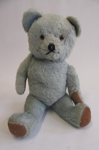 A 1950's "Blue" teddy, with amber eyes, sewn nose and rotating limbs, 18" high (Est. plus 21%