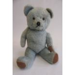 A 1950's "Blue" teddy, with amber eyes, sewn nose and rotating limbs, 18" high (Est. plus 21%