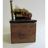 A Bowman E101 large steam engine single cylinder spirit fired boiler, on wooden base, some