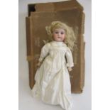 An Armand Marseille Floradora bisque socket head doll, with blue glass sleeping eyes, open mouth