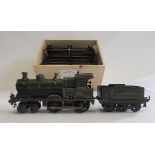 Bing clockwork 4-4-0 G.W.R. Tender Engine finished in green with 410 to cab and a quantity of