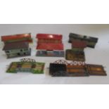 Tinplate trackside buildings by British and Continental makers comprising four platform buildings,